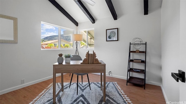 office space with vaulted ceiling with beams and wood-type flooring