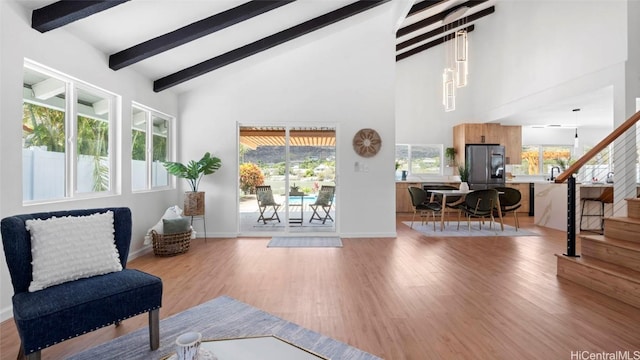 interior space featuring lofted ceiling with beams