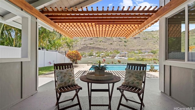 view of patio with a fenced in pool