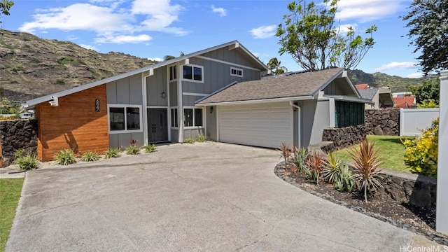 view of front of home featuring a mountain view and a garage