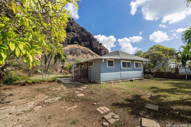 view of side of home with a mountain view