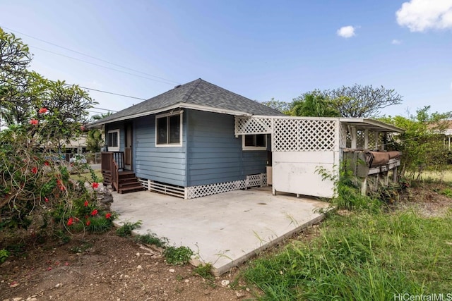 back of house with a patio