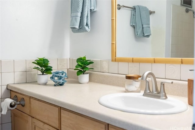 bathroom with backsplash, tile walls, and vanity