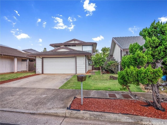 view of front of house with a garage and a front yard