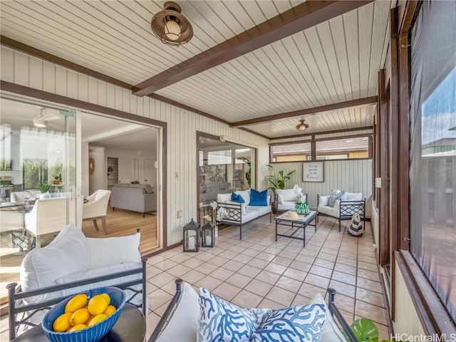 sunroom featuring beam ceiling and wooden ceiling