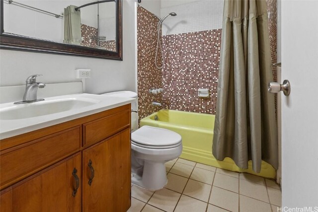 full bathroom with shower / bath combo, toilet, tile patterned flooring, and vanity