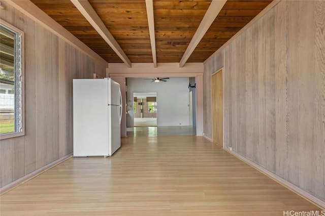 corridor featuring wooden walls, beamed ceiling, and wood ceiling