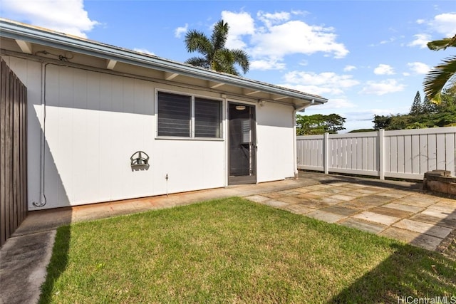 exterior space featuring a patio area and a yard