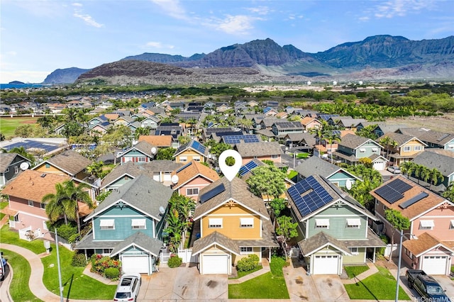aerial view featuring a mountain view and a residential view