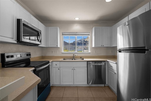 kitchen with white cabinetry, appliances with stainless steel finishes, and sink