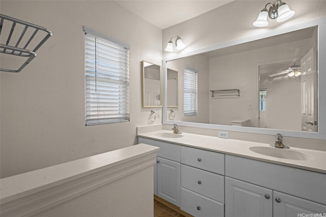 bathroom featuring double vanity and a sink