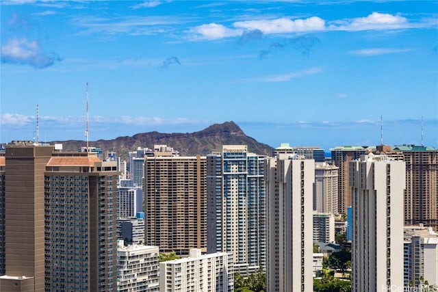 property's view of city featuring a mountain view