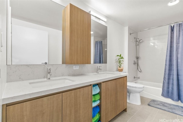 full bathroom featuring tile patterned floors, toilet, tasteful backsplash, shower / tub combo, and vanity