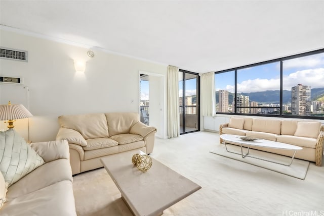 carpeted living room featuring crown molding