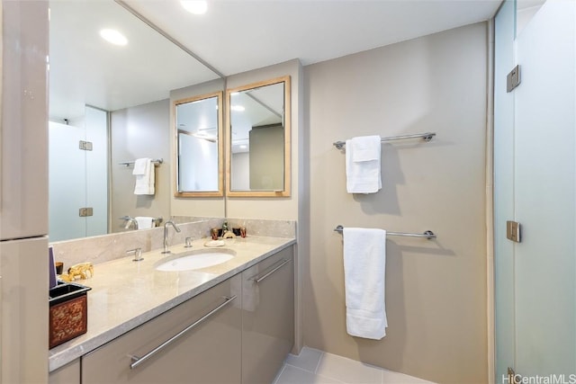 bathroom with tile patterned flooring and vanity