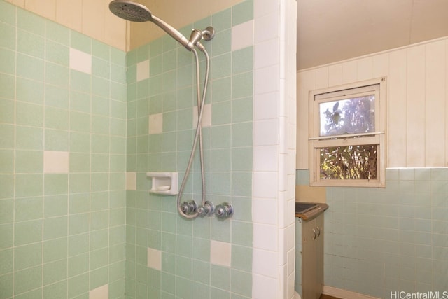 bathroom with tiled shower