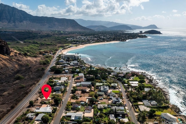 aerial view featuring a water and mountain view