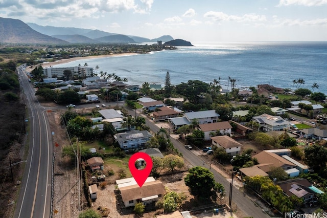 drone / aerial view with a water and mountain view