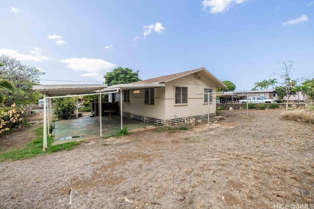 view of home's exterior with a carport