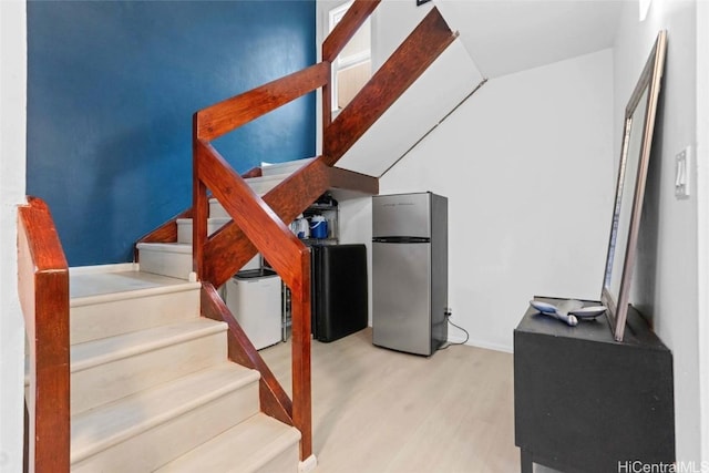 stairs with hardwood / wood-style floors