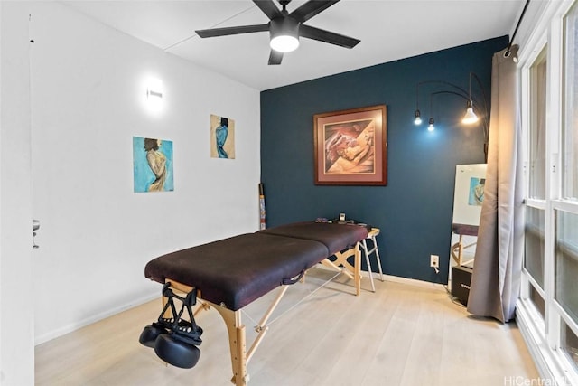 game room featuring ceiling fan and light wood-type flooring