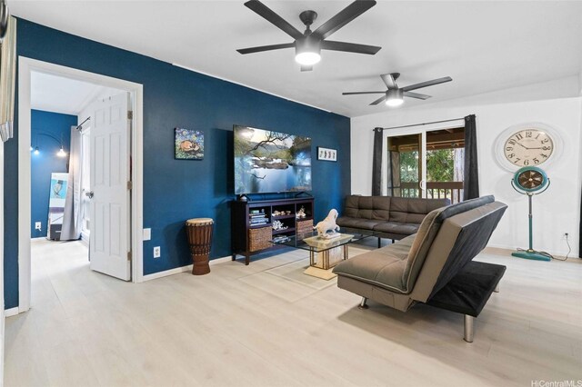45-381 Mokulele Dr Unit 34, Kaneohe, HI 96744 - living area with a ceiling fan, wood finished floors, baseboards, and an accent wall