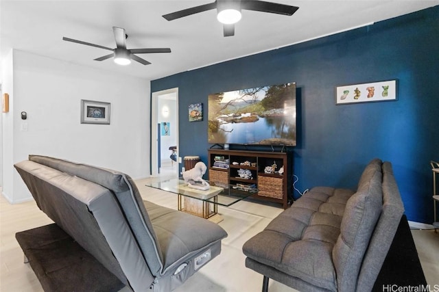 living room with light wood-type flooring and ceiling fan