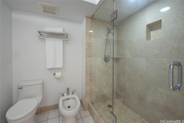 bathroom featuring tile patterned floors, a bidet, and an enclosed shower