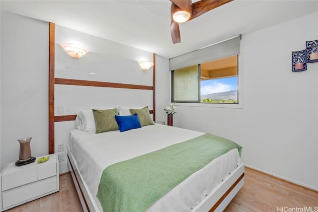 bedroom with ceiling fan and light wood-type flooring