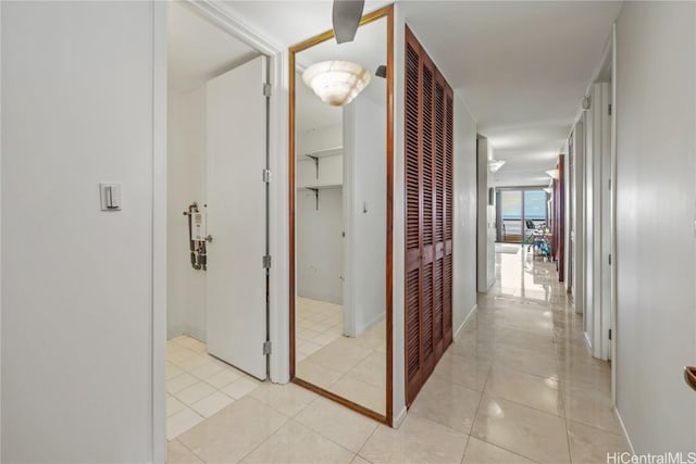 hallway featuring light tile patterned floors