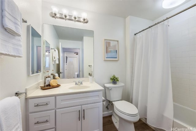 full bathroom with vanity, wood-type flooring, shower / tub combo, and toilet