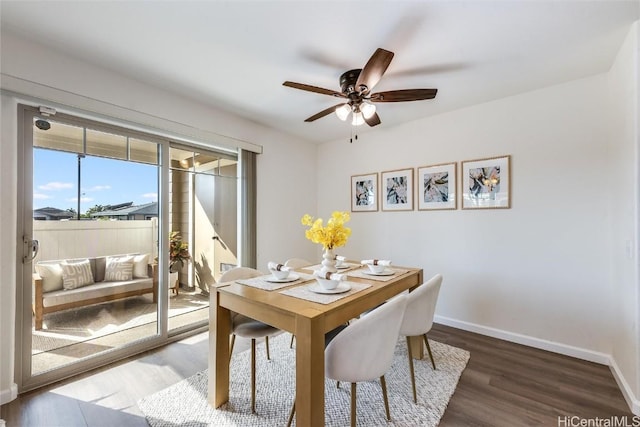 dining space featuring ceiling fan and dark hardwood / wood-style floors