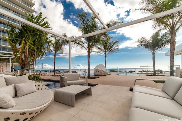 view of patio / terrace with an outdoor hangout area and a water view