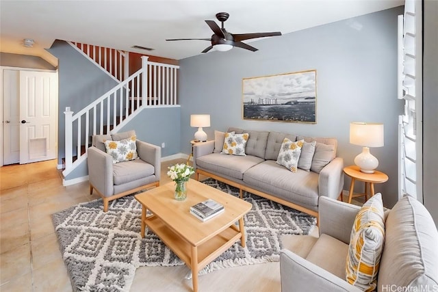 tiled living room featuring ceiling fan