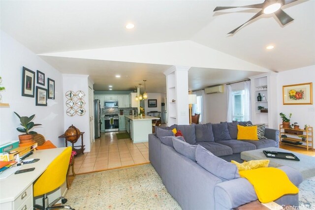 tiled living room with built in shelves, vaulted ceiling, a wall unit AC, and ceiling fan