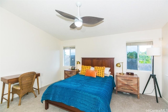 bedroom featuring ceiling fan and light carpet