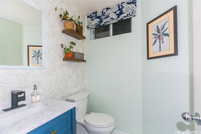 bathroom with vanity and toilet