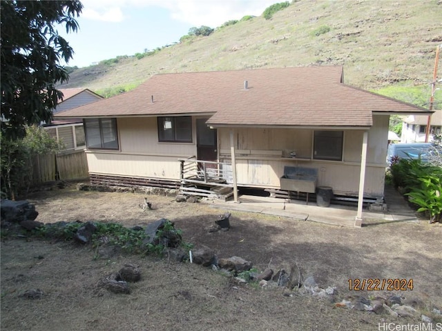 back of house featuring a mountain view