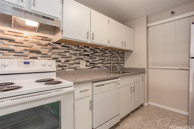 kitchen with sink, light tile patterned flooring, white appliances, decorative backsplash, and white cabinets