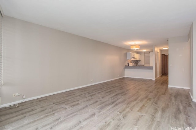 unfurnished living room with light wood-type flooring