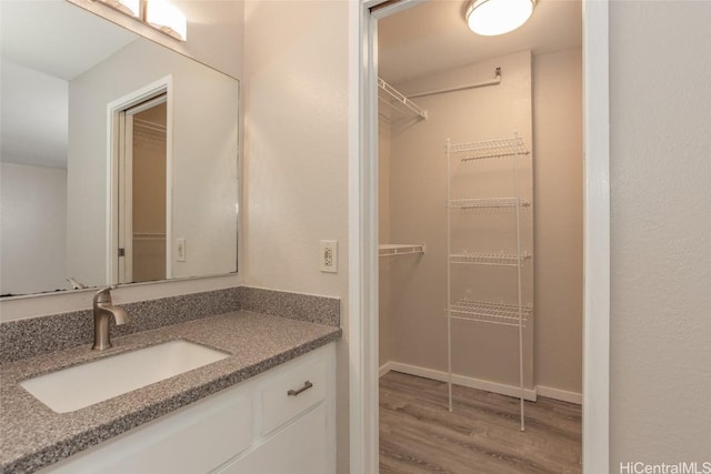 bathroom featuring vanity and wood-type flooring