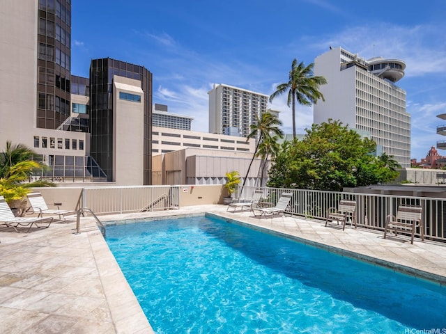 364 Seaside Ave Unit 403, Honolulu, HI 96815 - community pool with a patio area and a city view