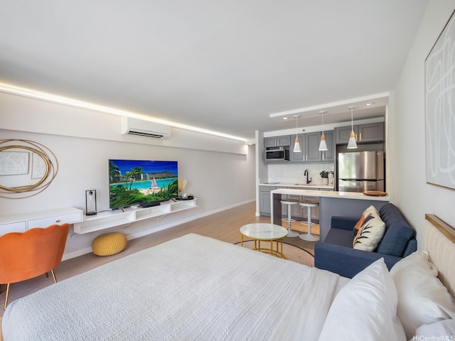 364 Seaside Ave Unit 403, Honolulu, HI 96815 - living area featuring a wall mounted AC and baseboards