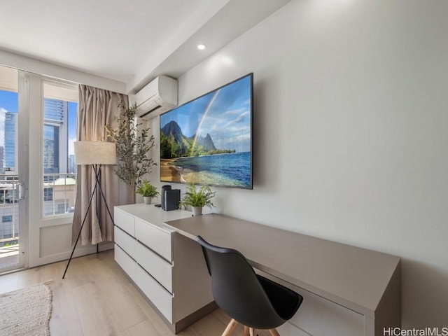 office space featuring light hardwood / wood-style flooring and a wall mounted AC