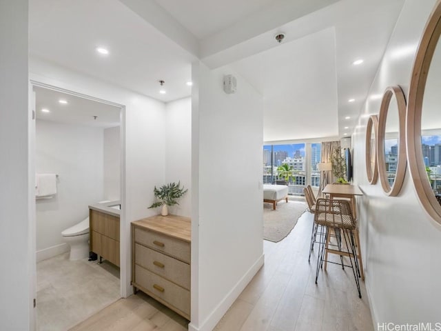 corridor featuring light hardwood / wood-style floors