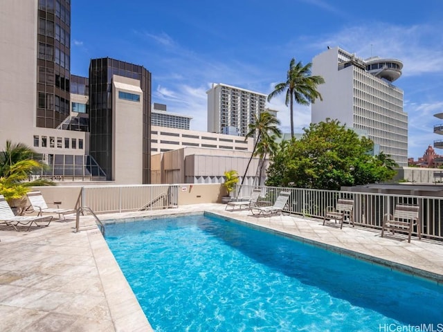 view of swimming pool featuring a patio