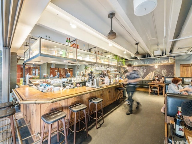 bar featuring concrete floors