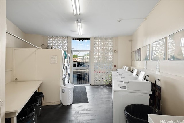 laundry area with stacked washer / dryer