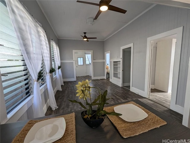 living room with ornamental molding and dark wood-type flooring