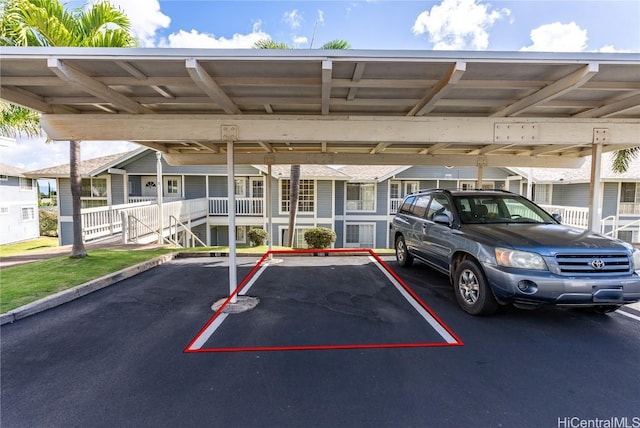 view of parking / parking lot with a carport